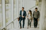 Group of corporate business professionals climbing at stairs in