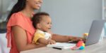 Kids And Technologies. Black Baby Boy Using Laptop With Mom At Home