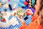 Quick And Healthy Salads For Any Occasion Close up young woman having pic nic eating salad